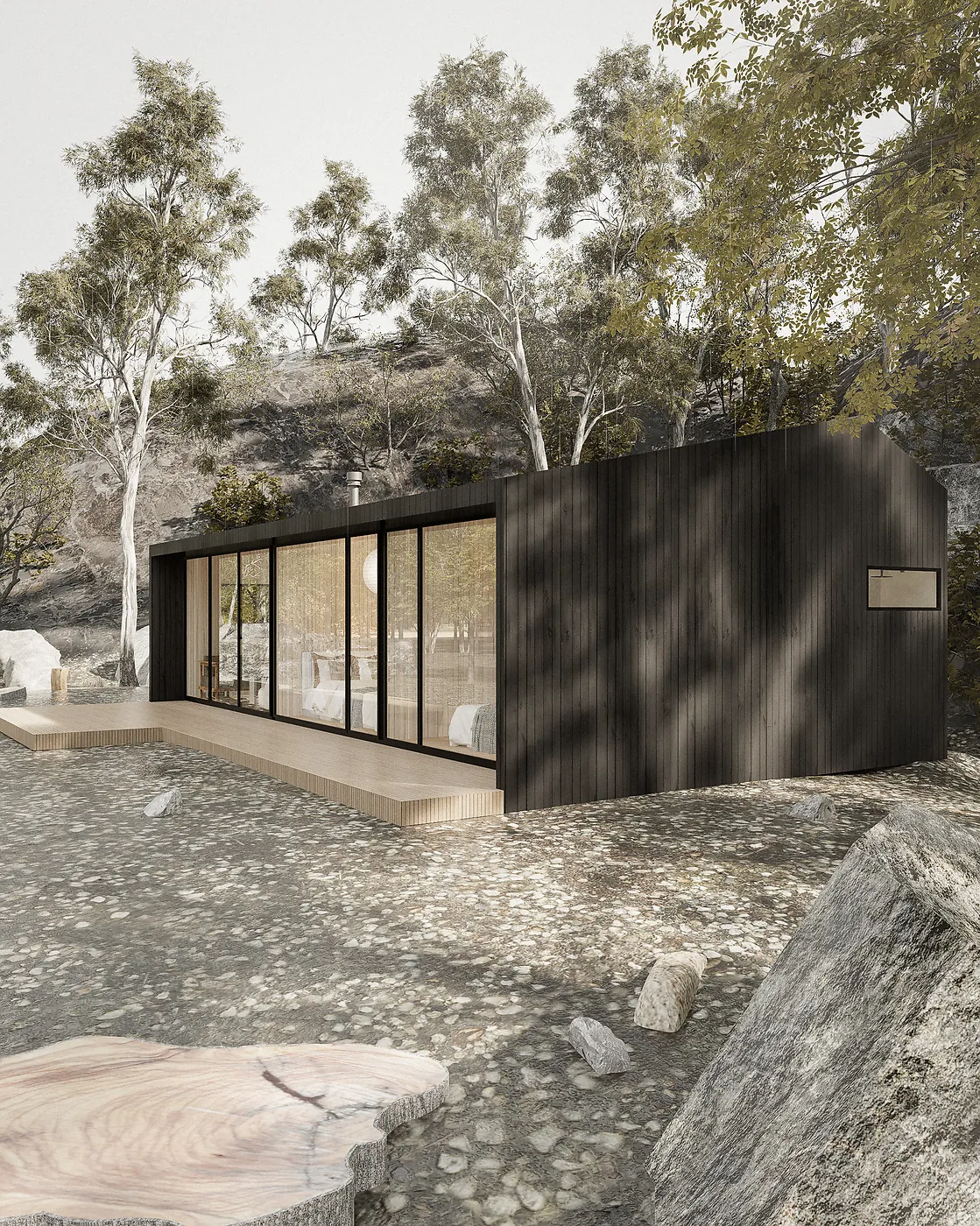 Refugio — cabaña prediseñada de acero prepintado negro entre árboles